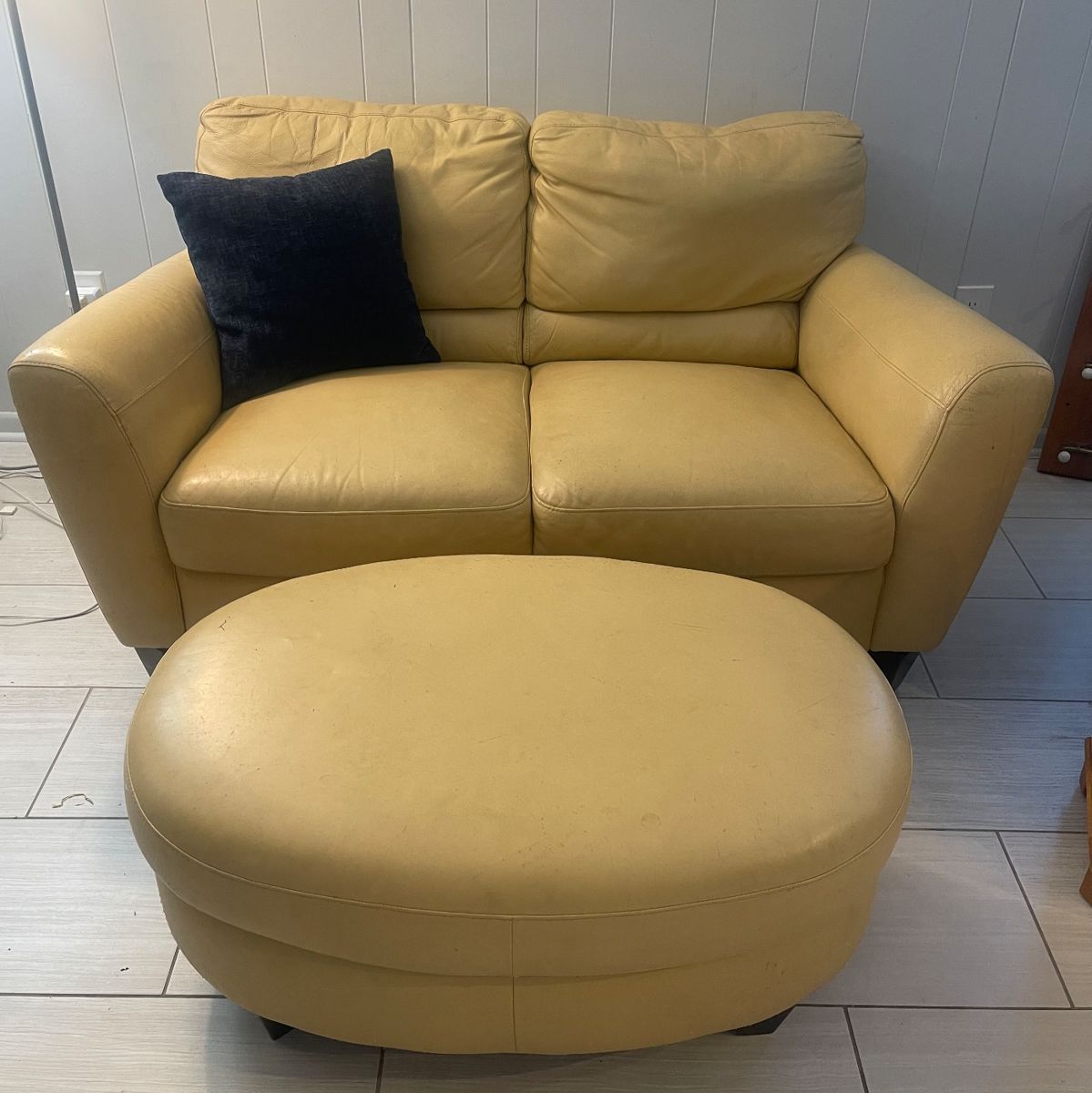 Leather loveseat w/ottoman 
just a few imperfections 