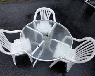 170 OutdoorMetalFrameWithGlassTopTableWith3WhitePlasticChairs