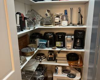 Pantry with small appliances and cookware 