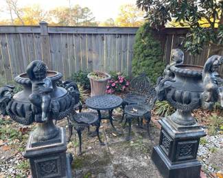 Pair of heavy iron urns, outdoor furniture
