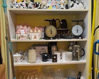 Pamtry full of a little of everything!  Cow collection, canisters, safes, cleaning items, primitives