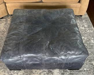 16. Grey Leather Ottoman (42" x 15")