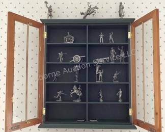 Pewter war figurines in cabinet