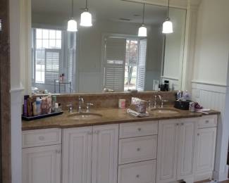 Double bath vanity by Mouser; pendant lights