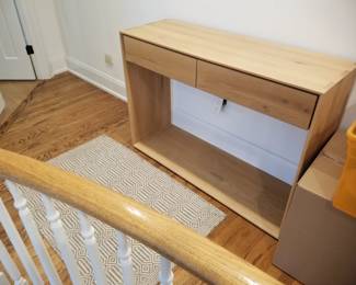 Oak Nordic console table; Pottery Barn area rug