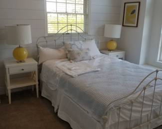 Wrought iron queen bed; pair of one-drawer nightstands; pair of Elsie table lamps by Kate Spade for Visual Comfort