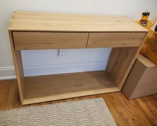 Oak Nordic console table; Pottery Barn area rug