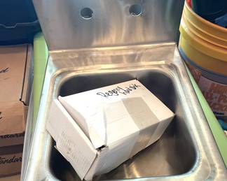 stainless steel hand sink with faucets and spout. super cool.