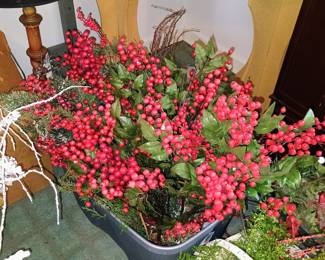 A lot of greenery and red berries