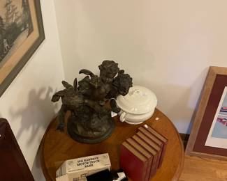 Truck coin bank; cherub sculpture; chamber pot with lid; law books; and small table, (not for sale)