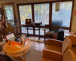IKEA table; Herman Miller chair set (3 connected chairs); antique child's school desk; cube end table; golf clubs; Frank Lloyd Wright window replica in window; vinyl records; vintage books; antique crutches; and more.