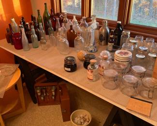 Glass bottles; jars; vintage plastic corks; vintage drink mixer case; etc.