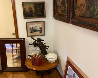 Oil paintings and prints; Japanese thread art; antique mirror; law books; chamber pot with lid; statue of three Cupids; small round table (sold)