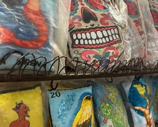Do you need unusual? Embroidered skull pillows and Loteria designs.