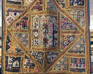 Large selection of wall hangings made with embroidered antique Indian textiles. So beautiful.