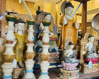 Hand carved and painted Buddha figures and candlesticks.