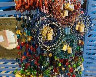 Hanging mobiles with glass beads and brass bells. Butterfly, flower and circle designs.