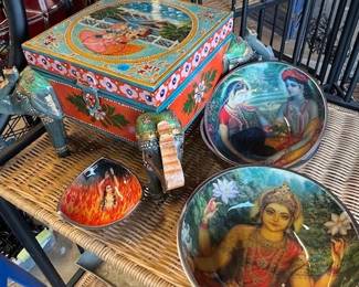 Prayer bowls and carved wood boxes.