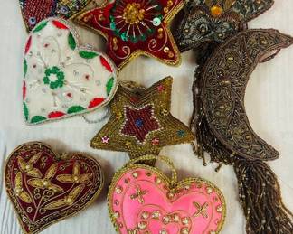 Hand embroidered fabric ornaments. Many designs and shapes. So lovely.