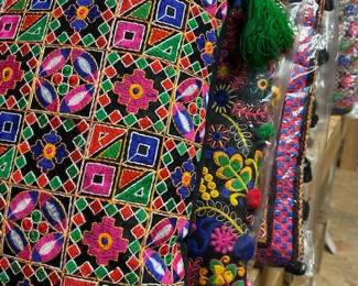 Large assortment of embroidered couch pillows in bright colors and assorted designs. Each pillow comes with insert. INSTANT color!