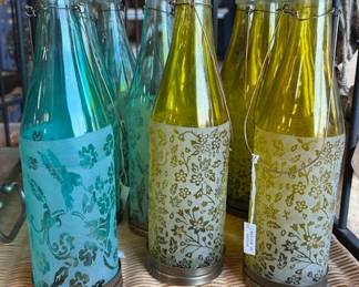 Bottle lanterns hold small tealight candles. Perfect for your patio.