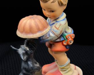 Hummel figurine titled "Begging His Share"