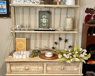 Vintage cream baker’s rack with wicker accents, two drawers, and open shelves. Sturdy metal frame with a cottage/farmhouse look. 