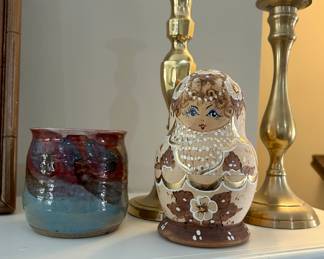 Hand-Painted Russian Matryoshka Doll 
Brass candlesticks (pair)
Studio pottery cup/vessel
