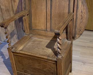 This Antique English Monk's Chair Bench is made of oak and features a unique convertible design, allowing it to be used as both a chair and a folding table. With its round shape and dark wood tone, this piece exudes a Renaissance style that adds a touch of elegance to any room. Manufactured in the United Kingdom during the 19th century, this versatile and timeless item is a true collectible for those with a appreciation for antique furniture.