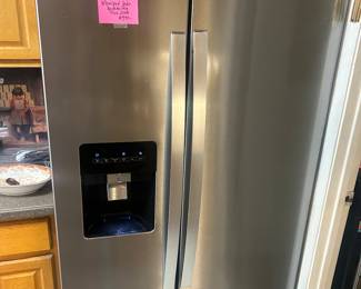 Whirlpool side-by-side refrigerator less than one year-old!