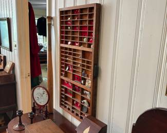 This display shelf will be priced separately from the items inside. The contents will be priced separately.