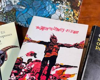 This lot features a collection of seven (7) vintage books by author, C. S. Lewis.