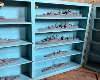 This lot features a complete set of WWII U.S. Navy recognition ship models in their original, self-contained wooden display case. These sets were manufactured by H.A. Framburg & Co. for the U.S. Navy Bureau of Aeronautics to help personnel identify friendly and enemy vessels during the war. This set measures (closed), 18.5” H x 36.5” W x 6.75” D. These models are generally considered 1/1200 scale, and were used as identification and training aids for the Navy during World War II.