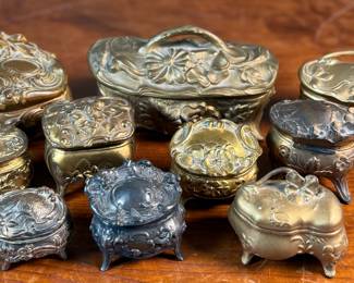This lot features a large collection of Art Nouveau-style metal jewelry caskets or trinket boxes.