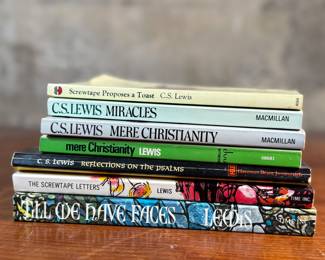 This lot features a collection of seven (7) vintage books by author, C. S. Lewis.