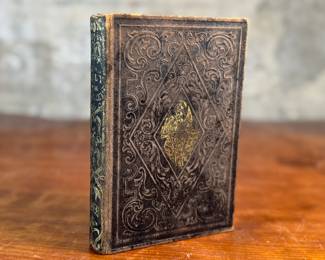 This lot features an antique hardcover book of, "The Lily of the Valley", edited by Elizabeth Doten circa 1854.