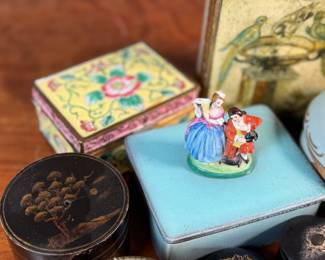 This lot features a large collection of antique jewelry and trinket boxes made from various materials by makers around the world.