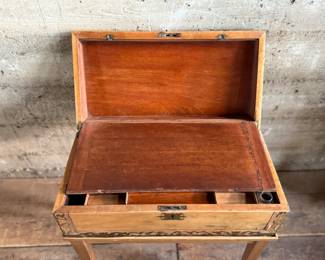 This lot features an incredible 19th century Italian travel desk on a wooden stand. The travel desk is removable and features numerous drawers and compartments inside. This piece measures (on the stand), 26” H x 20” W x 11” D.