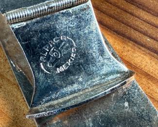 This lot features a collection of Alpaca silver jewelry featuring a horse pin/brooch, a pair of earrings, and a money clip. All items are marked Alpaca as shown in photos and have a total approx. weight of 50.14 grams.