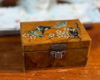 This lot features a collection of inkwells and accessories. One appears to be handmade out of wood and signed underneath by John R Craighead.