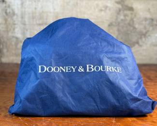 This lot features a Dooney & Bourke Florentine Satchel bag in blue Italian leather. This Dooney & Bourke comes with the original carry case as shown in photos and is in excellent condition.