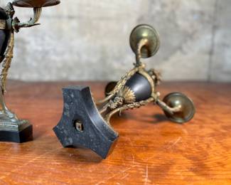 This lot features a pair of antique French gilt bronze and black marble candelabras in very good condition. Each one measures, 12” H x 8” W x 8” D.