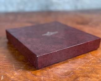 This lot features an iconic sterling silver heart necklace titled, "Chain of Hearts". A Hans Hansen design for Georg Jensen with a total approx. weight of 61.77 grams and measures, 15.5”. Comes in the original box and in excellent condition. The design features a series of meticulously crafted, solid silver heart shapes linked together to create an articulated, choker-style necklace. Maker marks present as shown in photos.