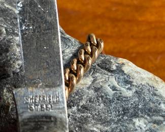 This lot features a pair of vintage pocket knives along with one being attached to a pocket knife chain, manufactured by H & H. Maker marks present as shown in photos.