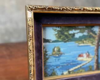 This lot features an antique embroidery cross stitch work of art, measures in frame, 8” H x 10” W.