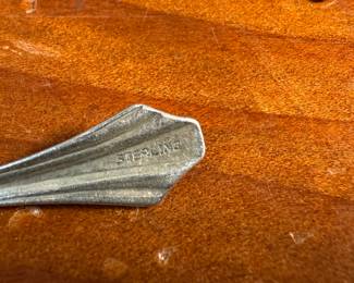 This lot features an antique set of six (6) salt cellars, accompanied by six (6) sterling silver spoons with a total approx. weight of 10.22 grams.