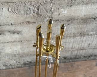 This lot features a mid-century fireplace tool set in excellent condition.