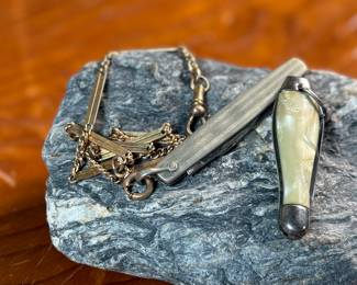This lot features a pair of vintage pocket knives along with one being attached to a pocket knife chain, manufactured by H & H. Maker marks present as shown in photos.