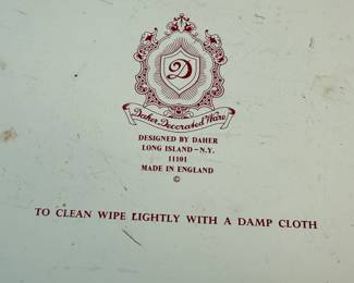 This lot features a collection of four (4) pieces of Daher Decorative Ware including two trays & two tin boxes. The largest tray measures, 13.75” H x 13.75” W. Daher’s most recognizable tins are decorated with detailed floral and geometric designs, rich in color, and often including metallic inks and raised or embossed relief. In addition to tin boxes, Daher also produced trays, plates, plaques, and other assorted tin ware for practical and decorative use.