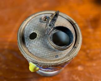 This lot features a collection of inkwells and accessories. One appears to be handmade out of wood and signed underneath by John R Craighead.